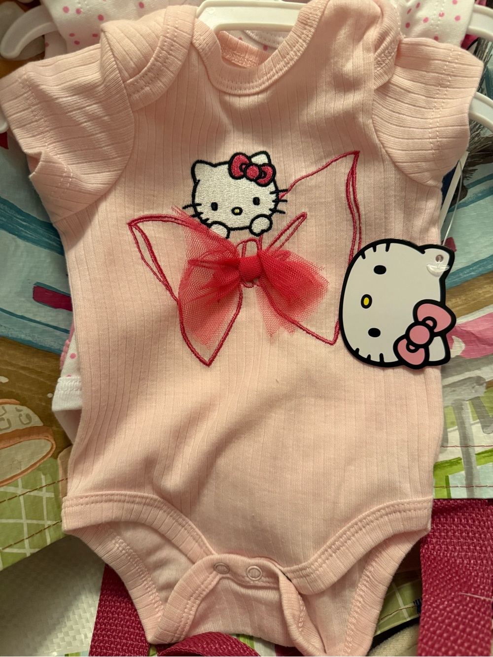 Hello Kitty Pink Onesie with Red Bow Detail